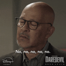 a man wearing glasses says no no no no no on a daredevil poster