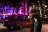 a man and woman are hugging in front of a building that has the word dixon on it