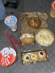a variety of food including a cup that says go boba boba on it