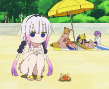 a girl in a bikini sits on the beach with a yellow umbrella in the background