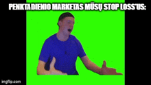 a man in a blue shirt giving a thumbs up on a green screen .