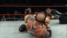 a wrestler with the number 12 on his shirt