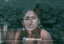a close up of a woman 's face with the twitter username @bhlibatsam in the corner