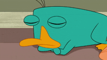 perry the platypus is holding an orange item in his paws