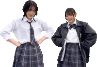 a girl wearing a plaid skirt and a white shirt has a black jacket on