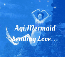 a picture of a mermaid with the caption " agi.mermaid sending love ... "