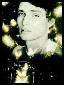 a man 's face is surrounded by butterflies and stars in a black and white photo