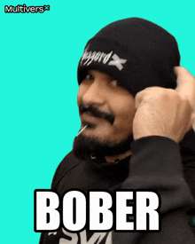 a man with a beard is wearing a beanie and the word bober is on the bottom