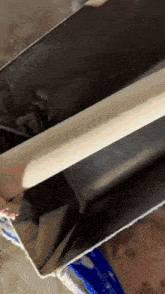 a person is using a rolling pin to roll something