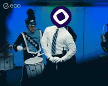 a man in a marching band has a purple circle on his head that says eco