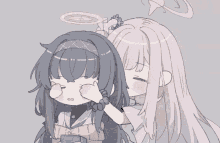 a drawing of a girl with long black hair and a pink haired girl with a halo