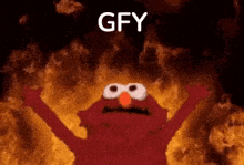 elmo is standing in front of a fire with the words `` gfy '' written on it .