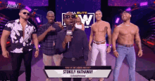 a group of men are standing in front of a sign that says stokely hathaway