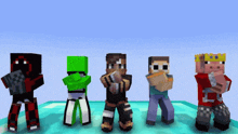 a group of minecraft characters are standing next to each other on a blue surface .