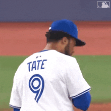 a baseball player with the name tate and the number 9 on his jersey