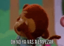 a stuffed animal with the words oh no ya vas a empezar on it 's face .