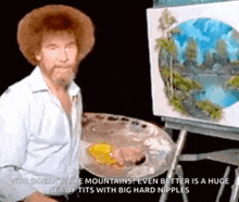bob ross is painting a picture of mountains on an easel .