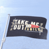 a black flag that says take me out flying in the wind