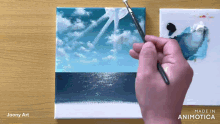 a person is painting a picture of the ocean with a brush and the words made in animotica on the bottom