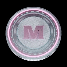 a clear plastic container with a pink letter m on it