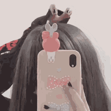 a girl is taking a picture of herself in a mirror .