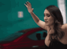 a woman in a black bra is making a face