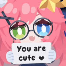 a girl with glasses is holding a sign that says " you are cute "