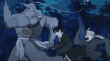 a man and a robot are fighting in a forest .