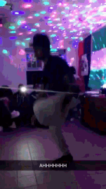 a snapchat of a man dancing with the words ahhhh on the bottom right