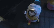 a stuffed minion with a name tag that says ' sally ' on it