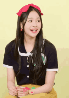 a girl wearing a blue shirt and a red headband