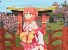 a girl in a kimono is standing in front of a torii gate