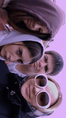 a group of people are posing for a picture together .