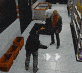 a man is standing in a store talking to another man while stacks of orange baskets sit on the floor
