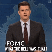 a man in a suit and tie is saying " fomc what the hell was that "