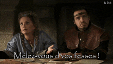 a man and a woman are sitting at a table with the words " melez-vous d' vos fesses " written below them