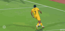 a soccer player with the number 25 on his jersey jumps in the air