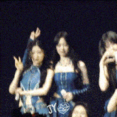 a blurry picture of a group of women with the letters jy on the bottom