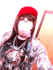 a woman wearing a red hat and a skull shirt