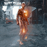 a man in a flash costume stands in front of a fire truck