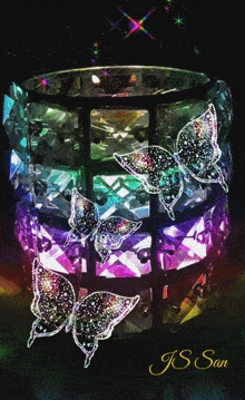 a picture of a candle holder with butterflies and the name js san on the bottom