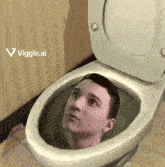 a man is sitting in a toilet with his head sticking out of it