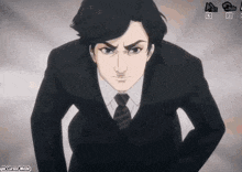 a man in a suit and tie is looking at the camera