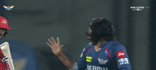 a man in a blue shirt that says dream11
