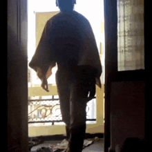 a person standing in front of a door with the letter o on the bottom