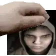 a hand is holding a man 's head in front of a picture of a man in a hoodie .