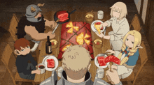 a group of people are sitting around a table with plates of food