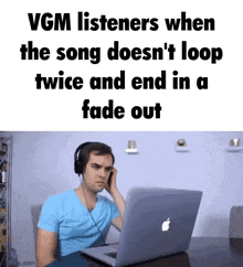 a man wearing headphones is listening to a song on a laptop .