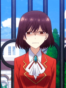 a girl in a red suit with a diamond necklace is making a funny face