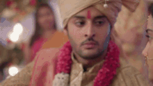 a close up of a bride and groom 's faces